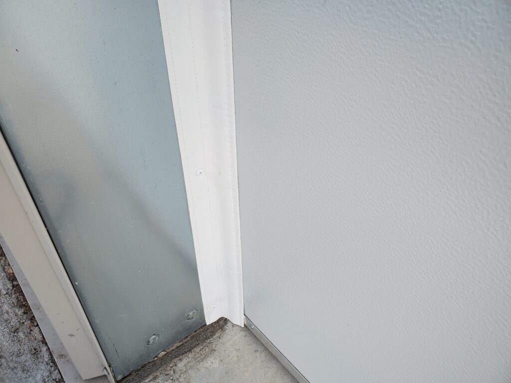 SnirtStopper SideSealer shown installed on garage door jam