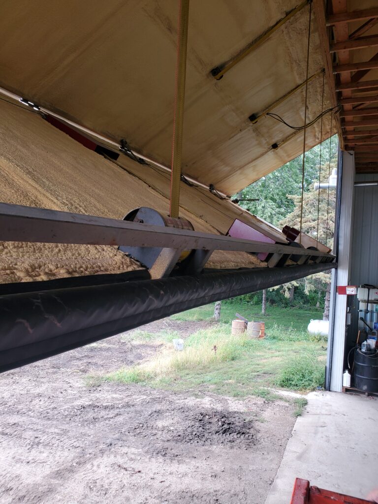 SnirtStopper XXL BottomSealer shown installed on a large bi-fold shop door.